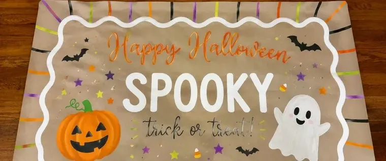 A hand-painted Halloween banner made by SATX Painted Banners